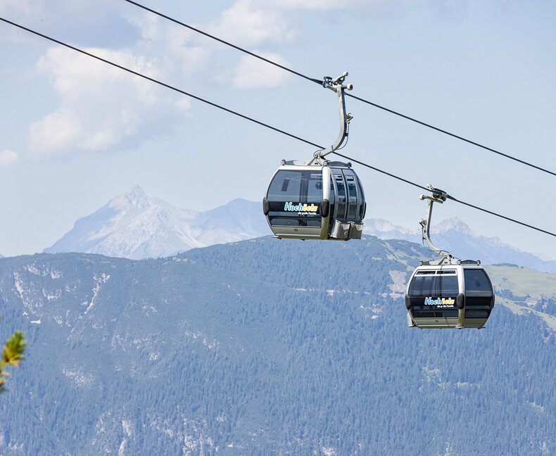 Summer mountain lifts 
across the valley